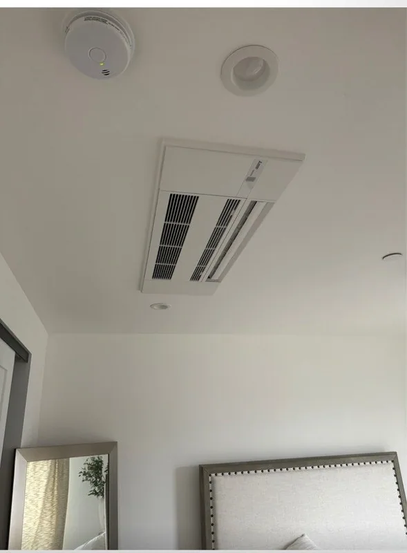 Ductless mini-split indoor head mounted high on an interior wall